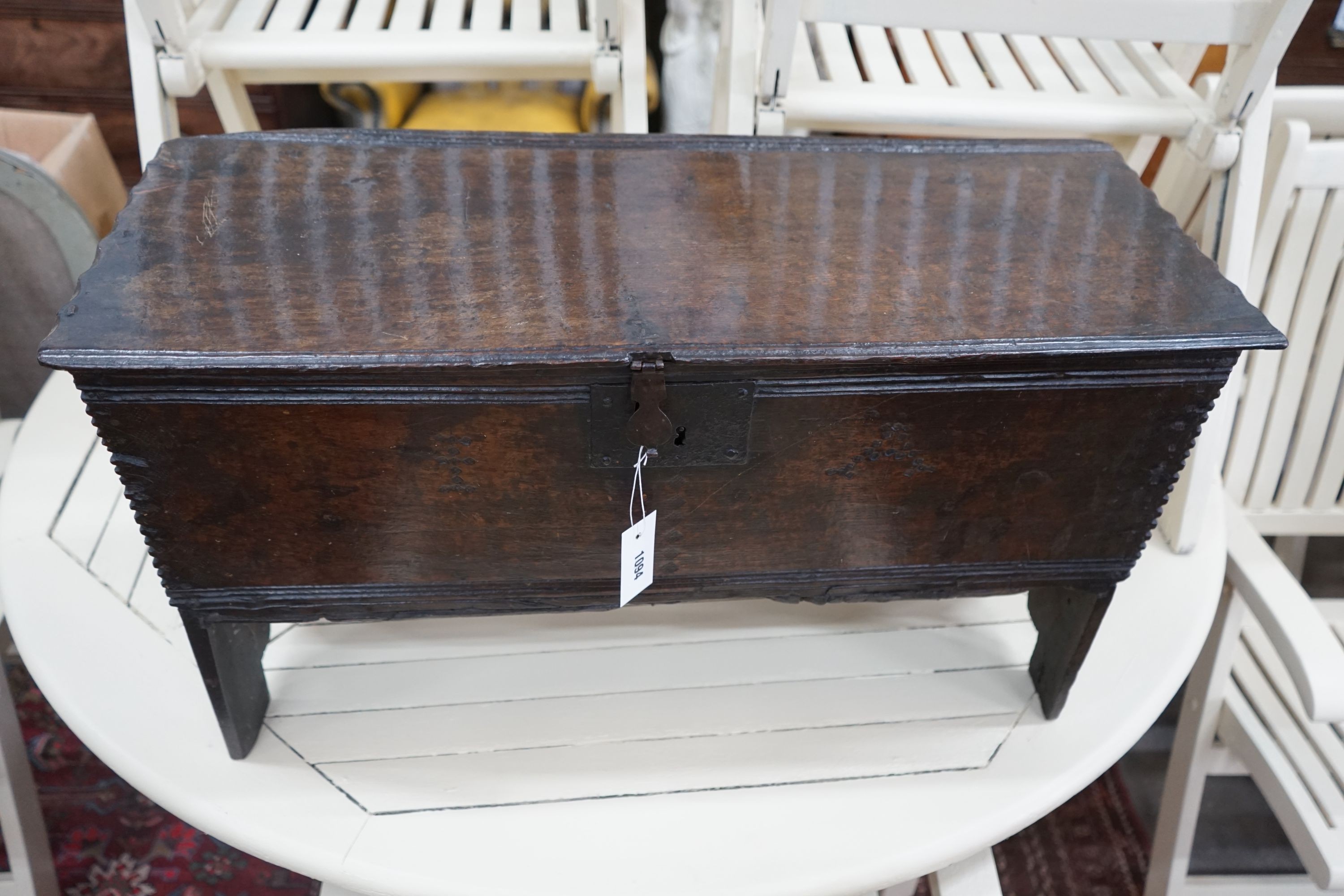 A small 17th century oak six plank coffer, punch struck with the initials I A, width 79cm, depth 32cm, height 44cm